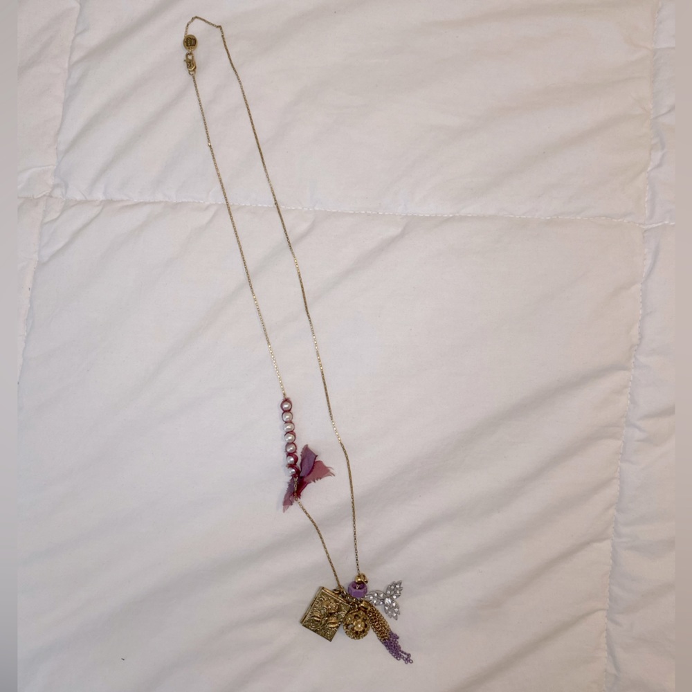 Juicy Couture charm necklace. Gold with purple detailing.